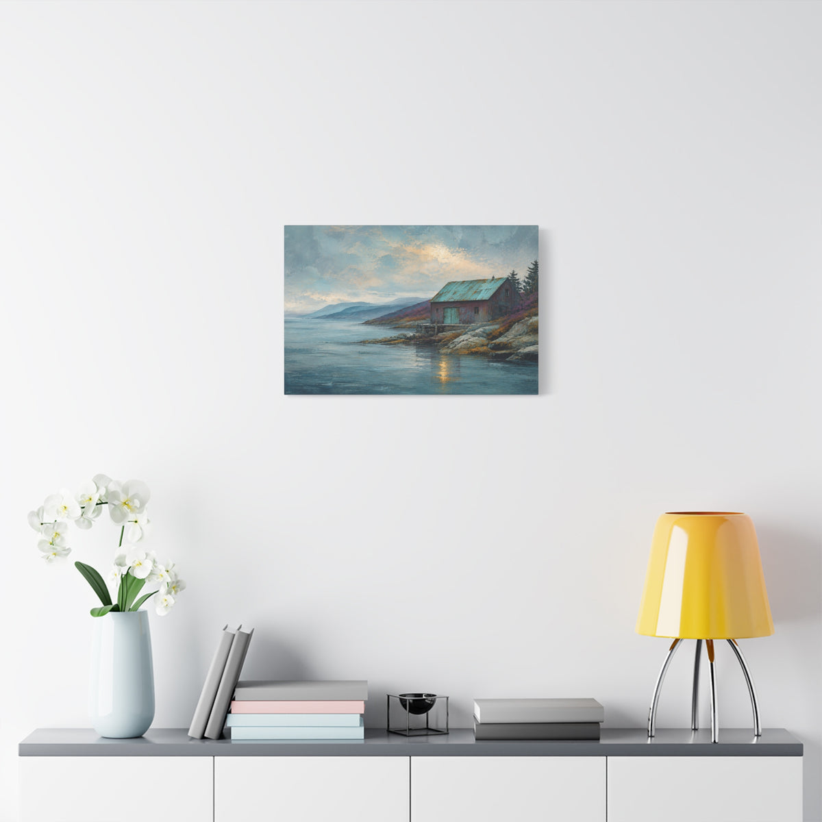 Blue Copper Coast canvas print — A weathered coastal boathouse with a patina-green roof sits beside a rocky shore.